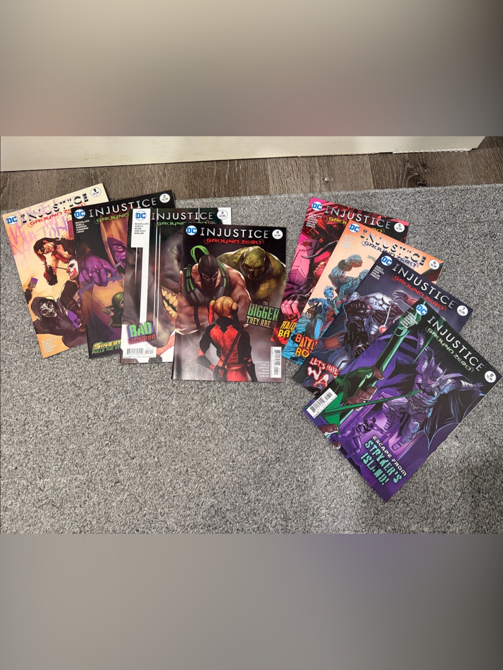 Comics on floorDC Injustice comic series